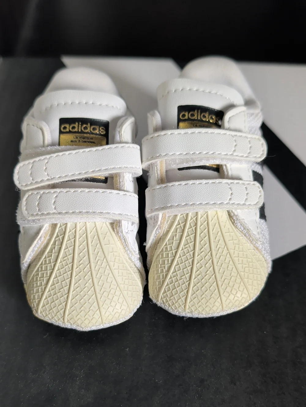 adidas White and Black Baby Sneakers with Gold Logo